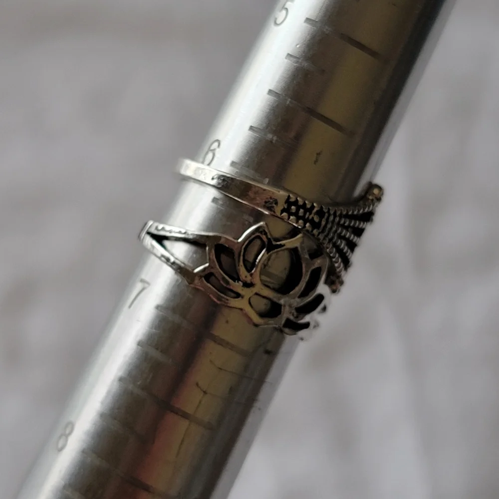 Four Fashion Stacking Rings Silver Tone Paisley and Crown Lotus Flower